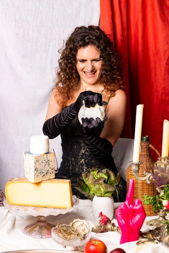 Emily Monaco ripping apart a camembert